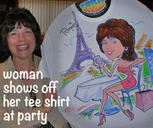 Picture of a woman holding a caricature shirt of her